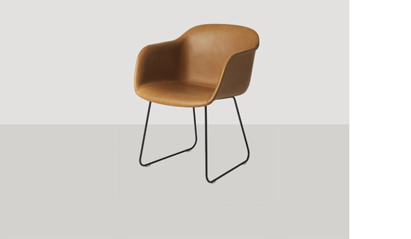 Fiber chair, here upholstered with cognac silk leather and black sled base, by Iskos-Berlin / Muuto.