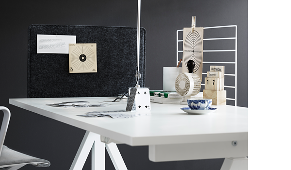 SALE! String wire screen and fabric sleeve on white table. The wire screen works well as a divider between workstations and, as a bulletin board. Adding the fabric sleeve creates privacy and sound absorbing qualities.