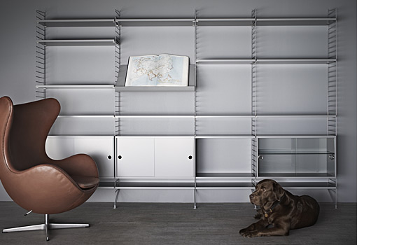 String shelving system. Shown here with grey shelves, panels and cabinets.