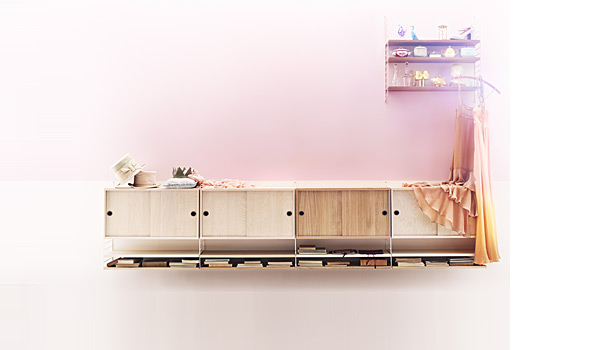 String shelving system. Shown here as a sideboard combination with wall panels and cabinets.