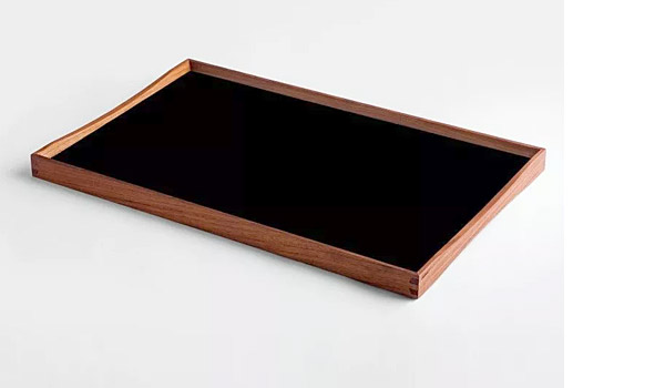 Turning Tray serving tray, here the black backside of the medium version, by Finn Juhl / Architect Made.